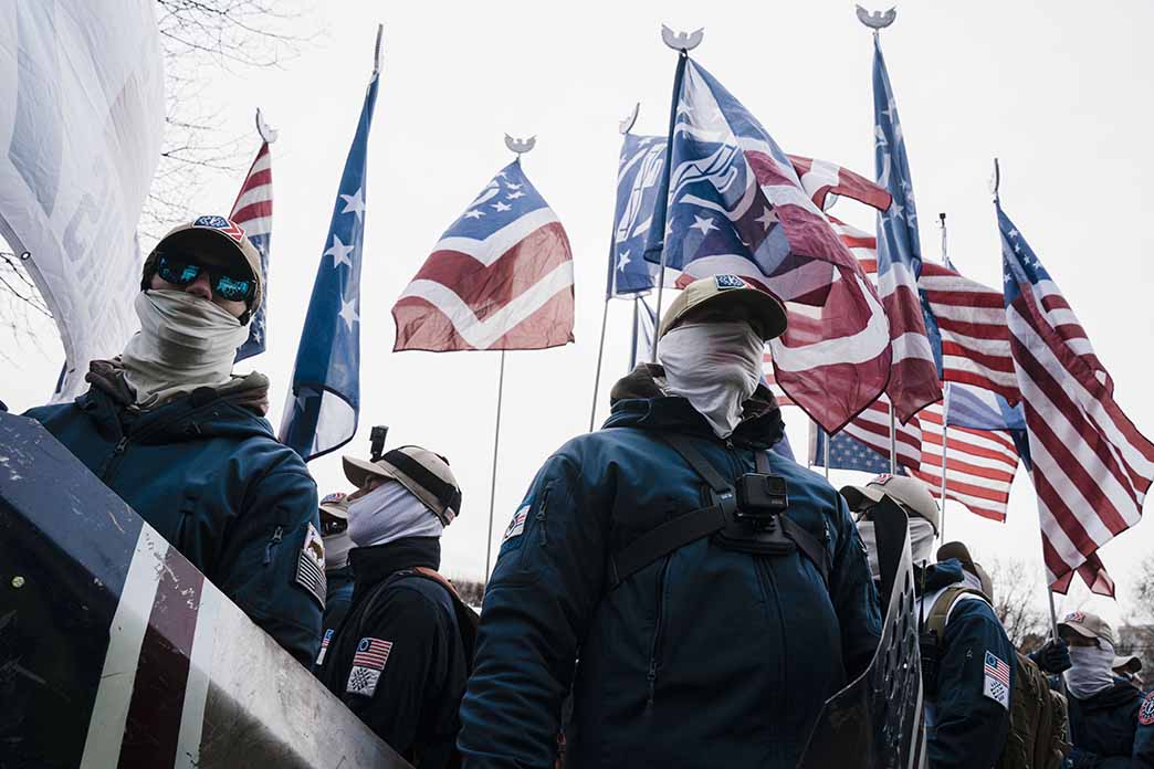 Members of the white nationalist Patriot Front under U.S. and other flags Members of the white nationalist Patriot Front under U.S. and other flags
