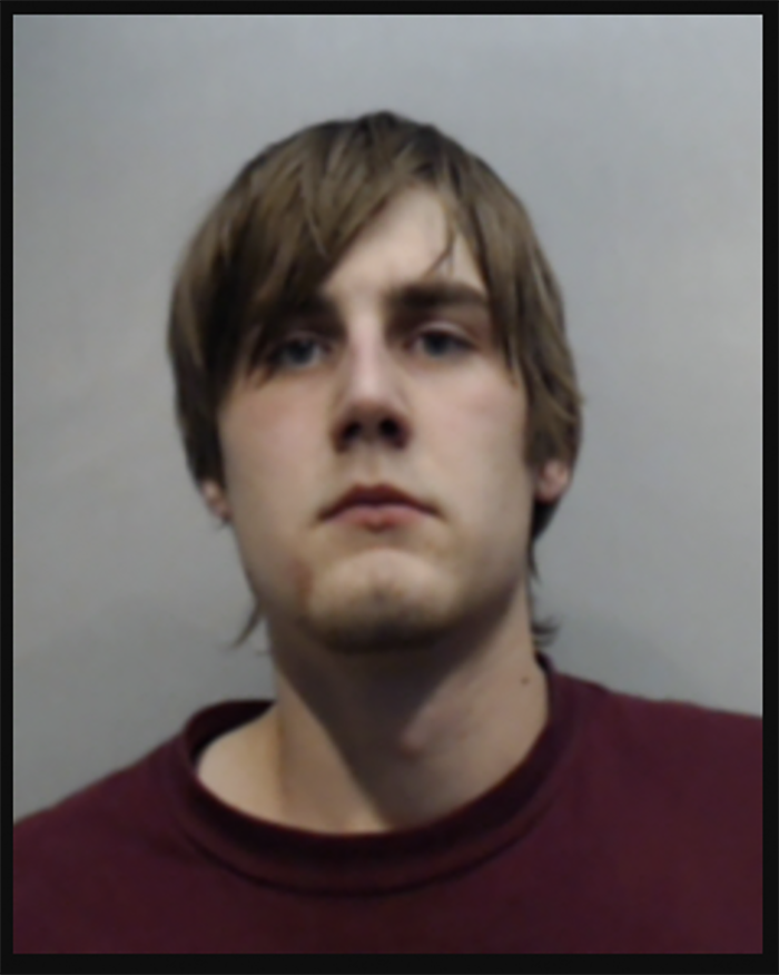 Cole booking photo