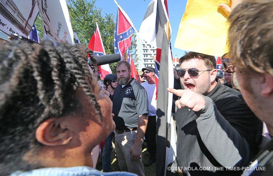 R.G. Miller, center, stands by while LOS member Garon Archer berates a female counter-protester.