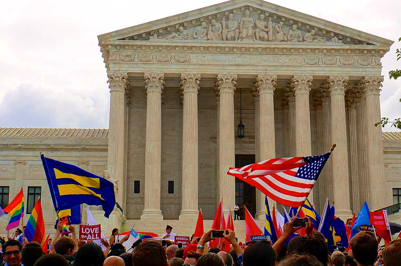  A crowd celebrates outside the United States Supreme Court. 