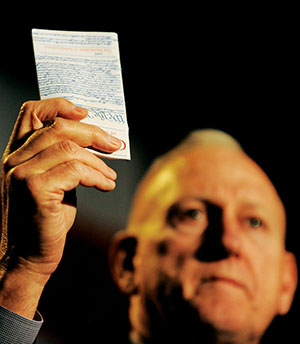 Jerry Boykin holding a copy of the U.S. Constitution