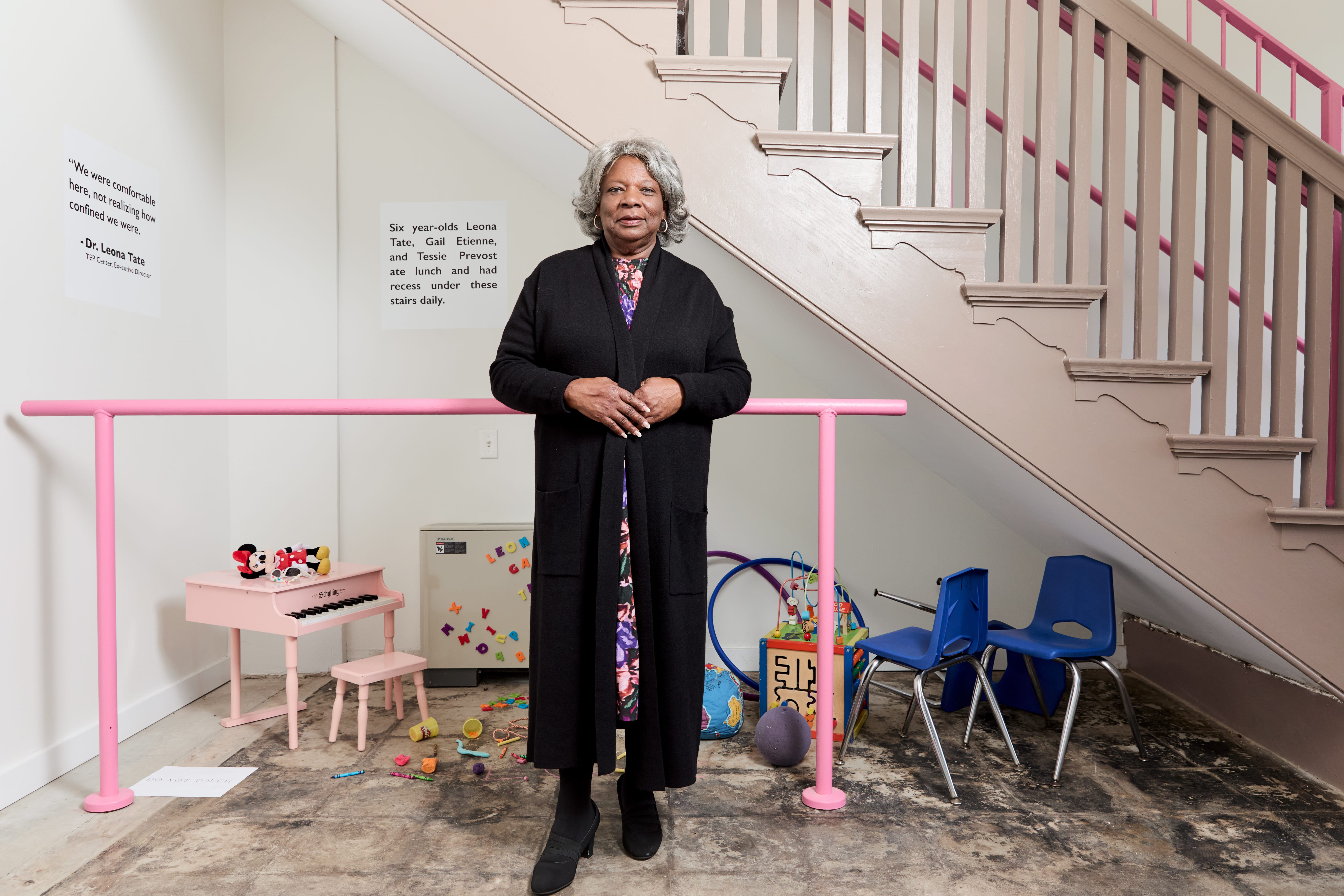 a woman stands in a museum