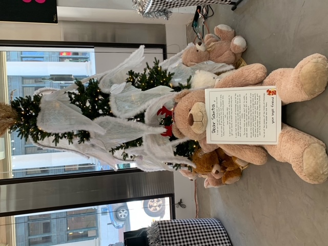 A Christmas tree with teddy bears and a letter to Santa on display during Festival of Trees.