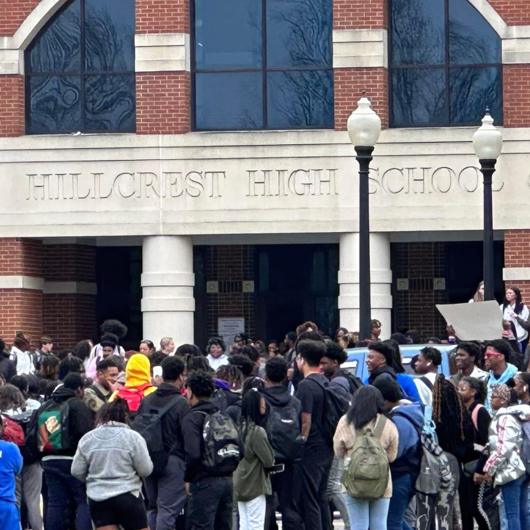 crowd of students outside of a high school
