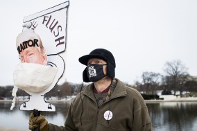 Bill Wood with sign depicting trump in toilet