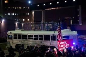 People attend a vigil outside the Central Detention Facility in Washington, D.C.