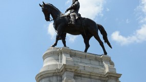 A statue of Gen. Robert E. Lee towers over Monument Avenue in Richmond, Virginia. A statue of Gen. Robert E. Lee towers over Monument Avenue in Richmond, Virginia.