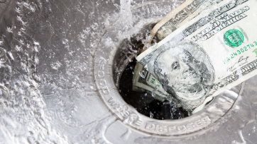 a $100 bill washes down the drain