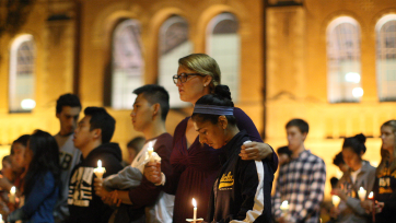 students at a candlelight vigil