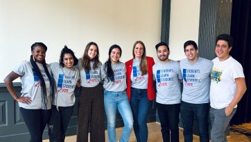 a group of students. Their t-shirts say "Students Learn, Students Vote"