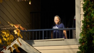 Person in stairwell of apartment building.