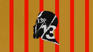 A black and white silhouette of a person against a vibrant red and gold striped background.