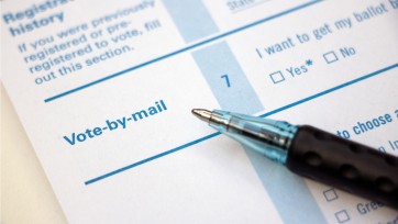voter registration form and pen