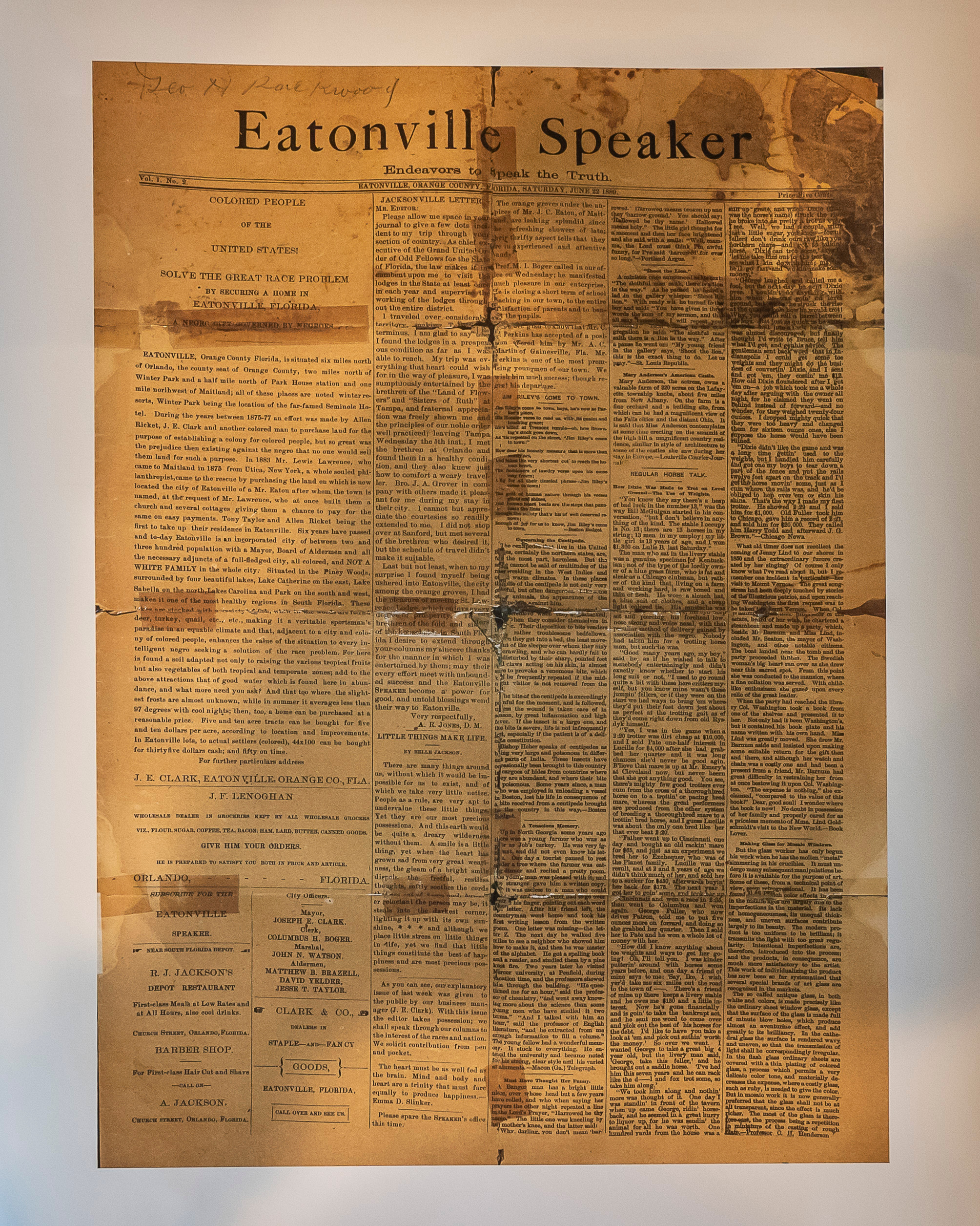 Preserved paper clipping held together with tape. 