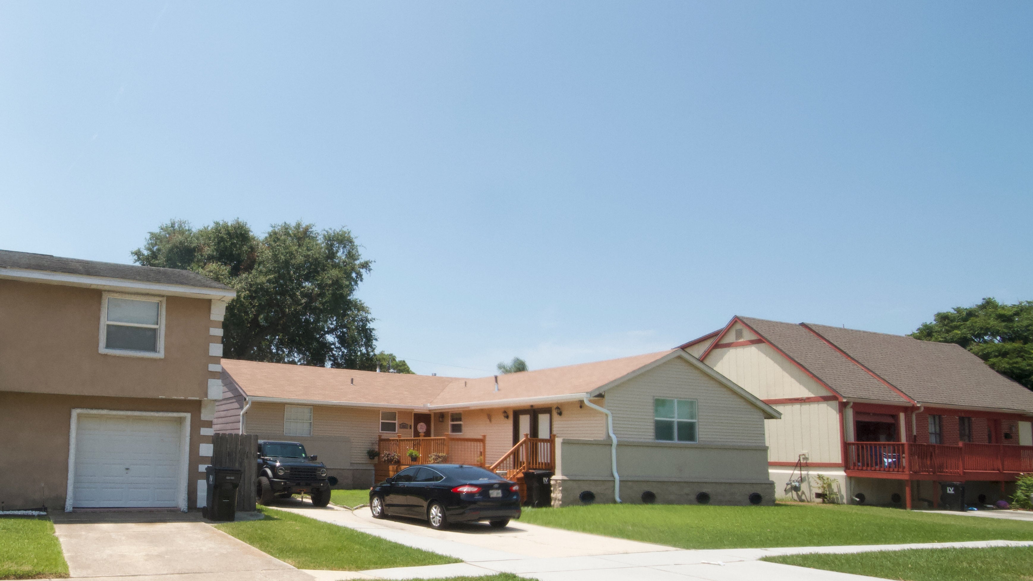 Three homes in Kenner, Louisiana, rebuilt at different grade levels