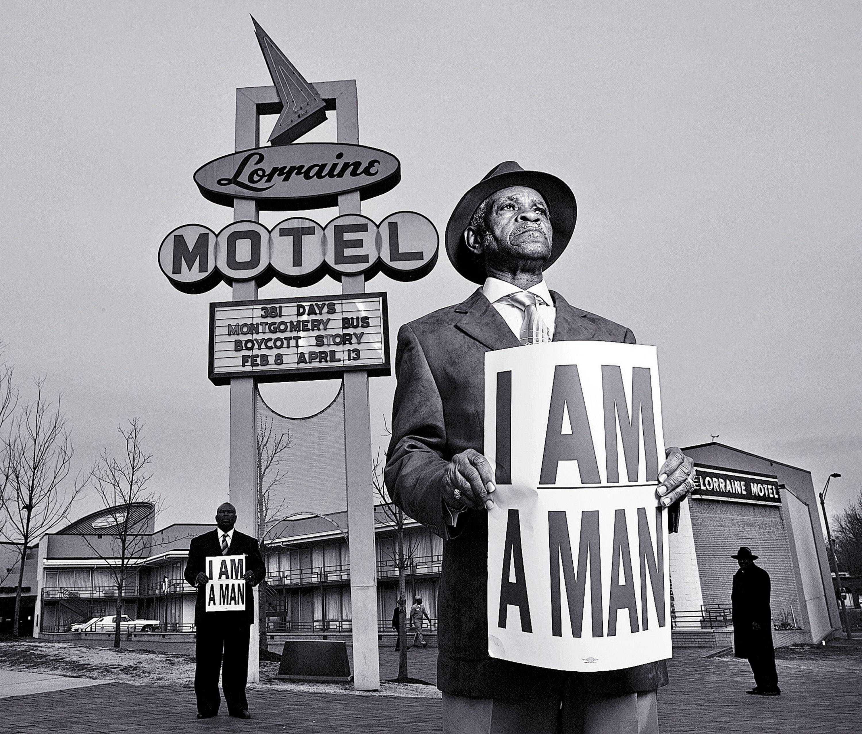 People hold signs that read "I Am A Man" outside Lorraine Motel in Memphis Tennessee.