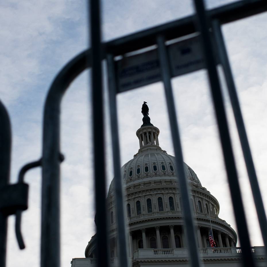 View of U.S. Capitol dome through barricade