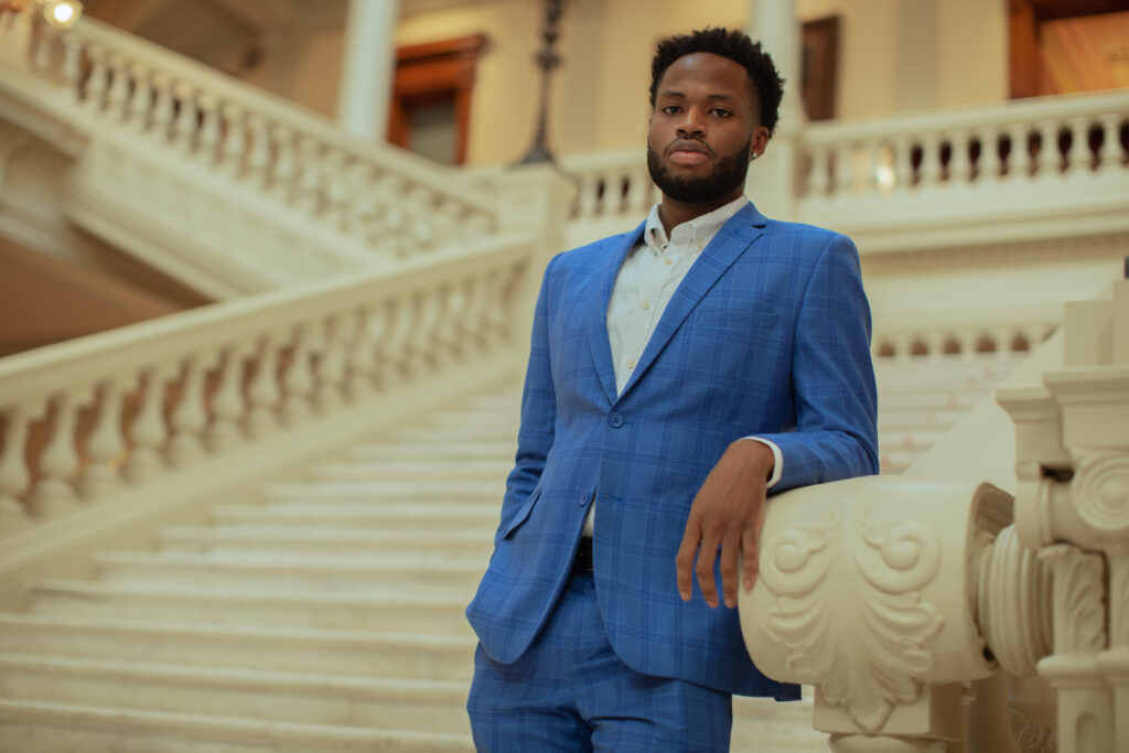 Bryce Berry leans on a railing in the Georgia State Capitol.