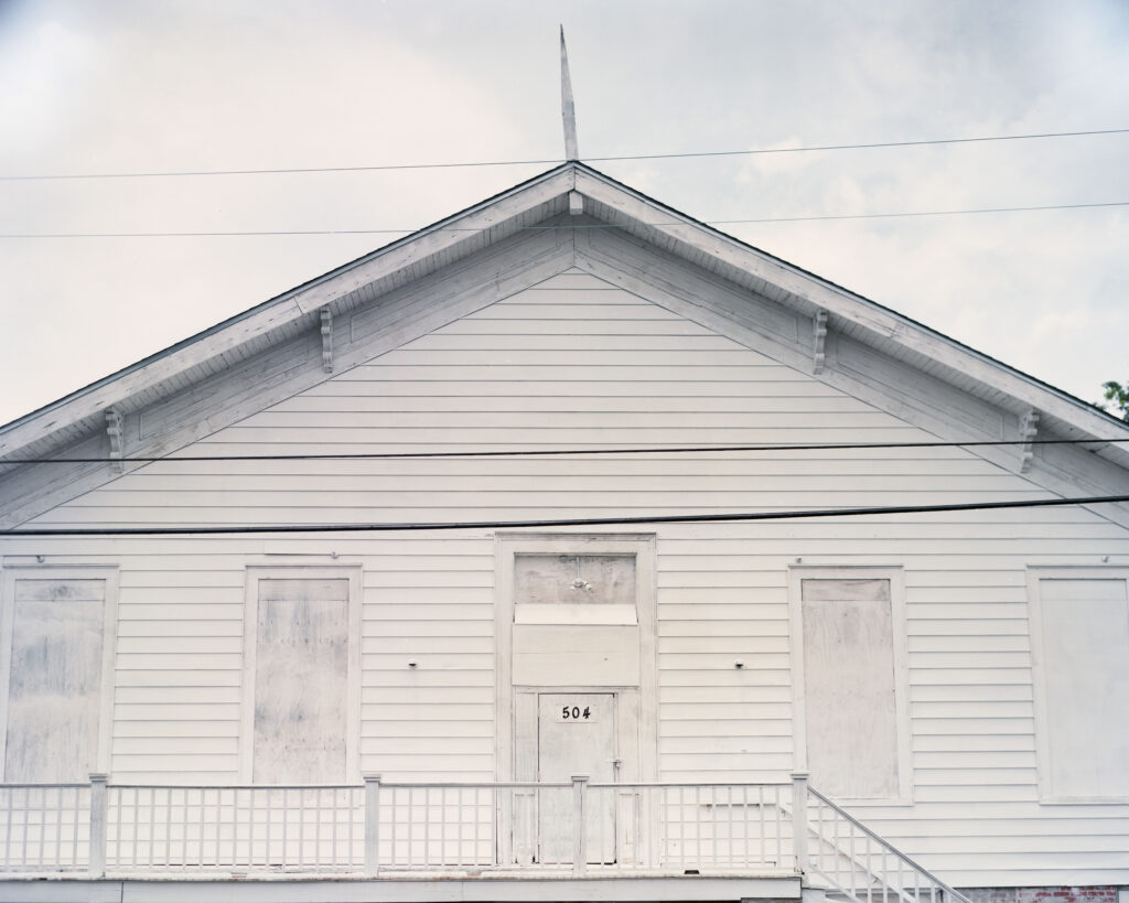 A white house under an overcast sky.
