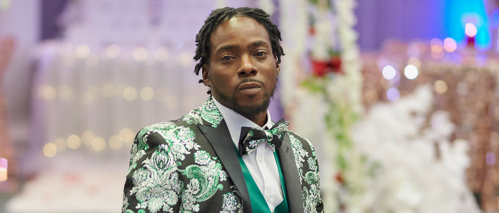 Portrait of person in a tuxedo in splendid color.