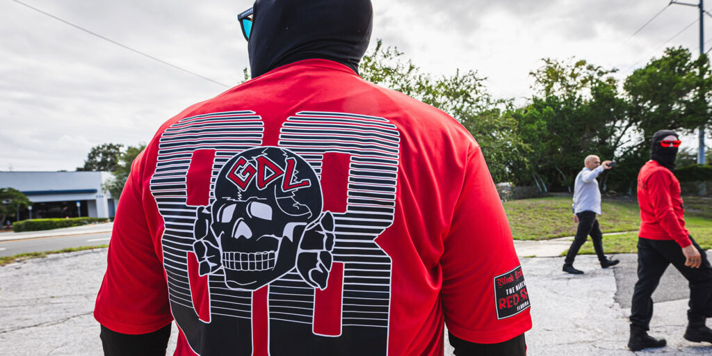 Back of person wearing Goyim Defense League paraphernalia.