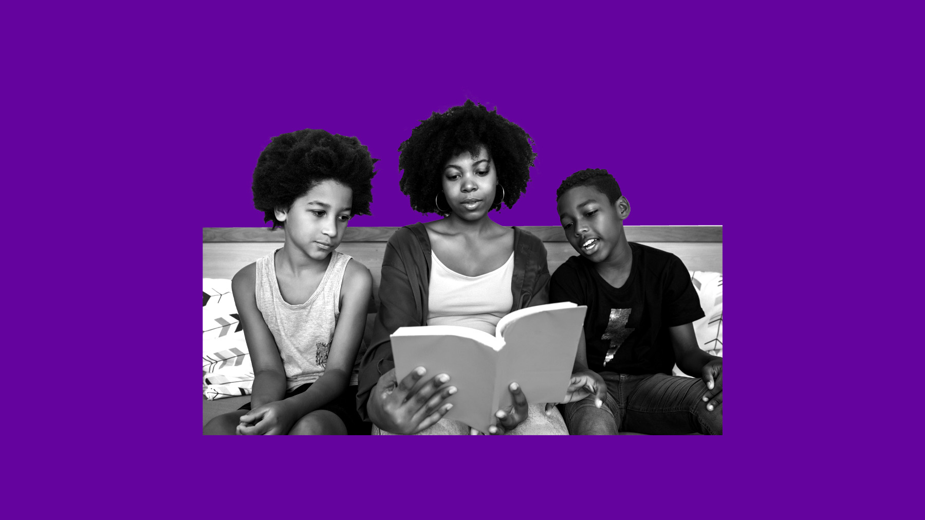 Adult woman and two children reading and discussing
