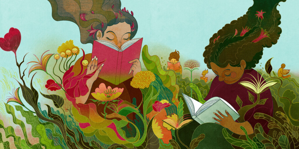 two students sit among flowers, reading books