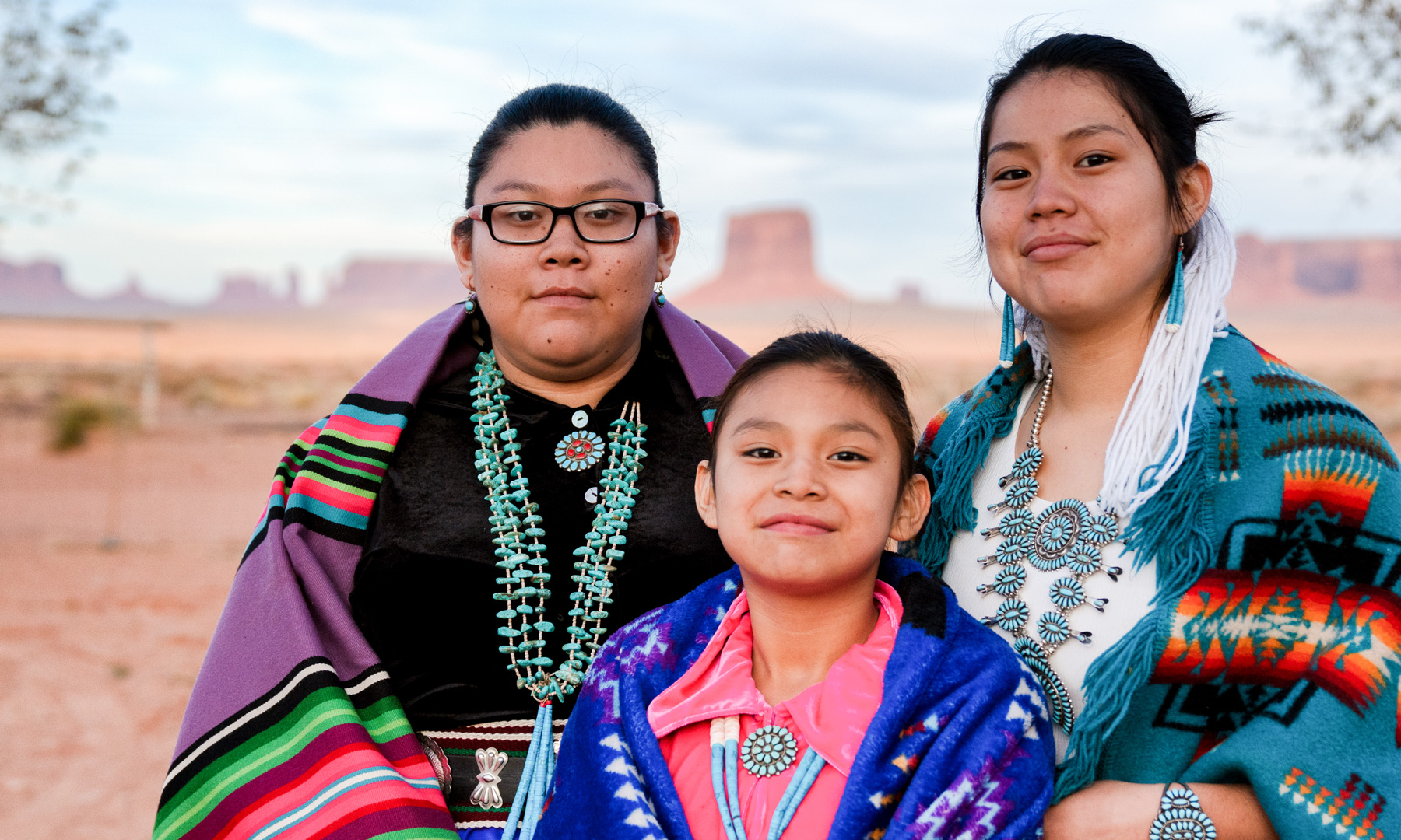 Three Native Americans in traditional dress