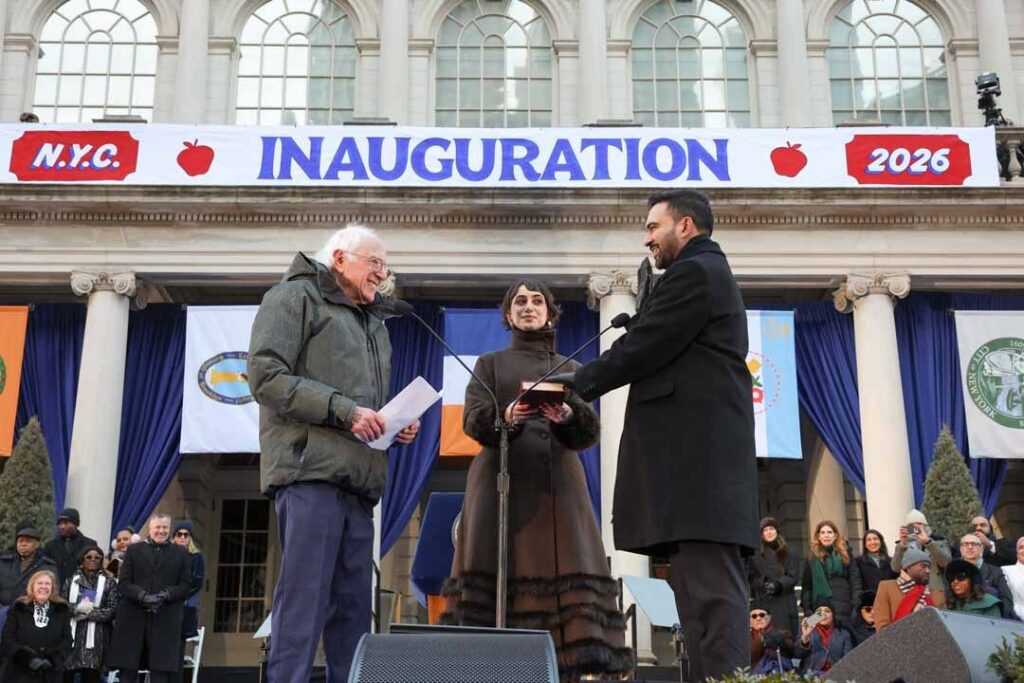 Three people in an outdoor setting under a banner labeled: Inauguration.