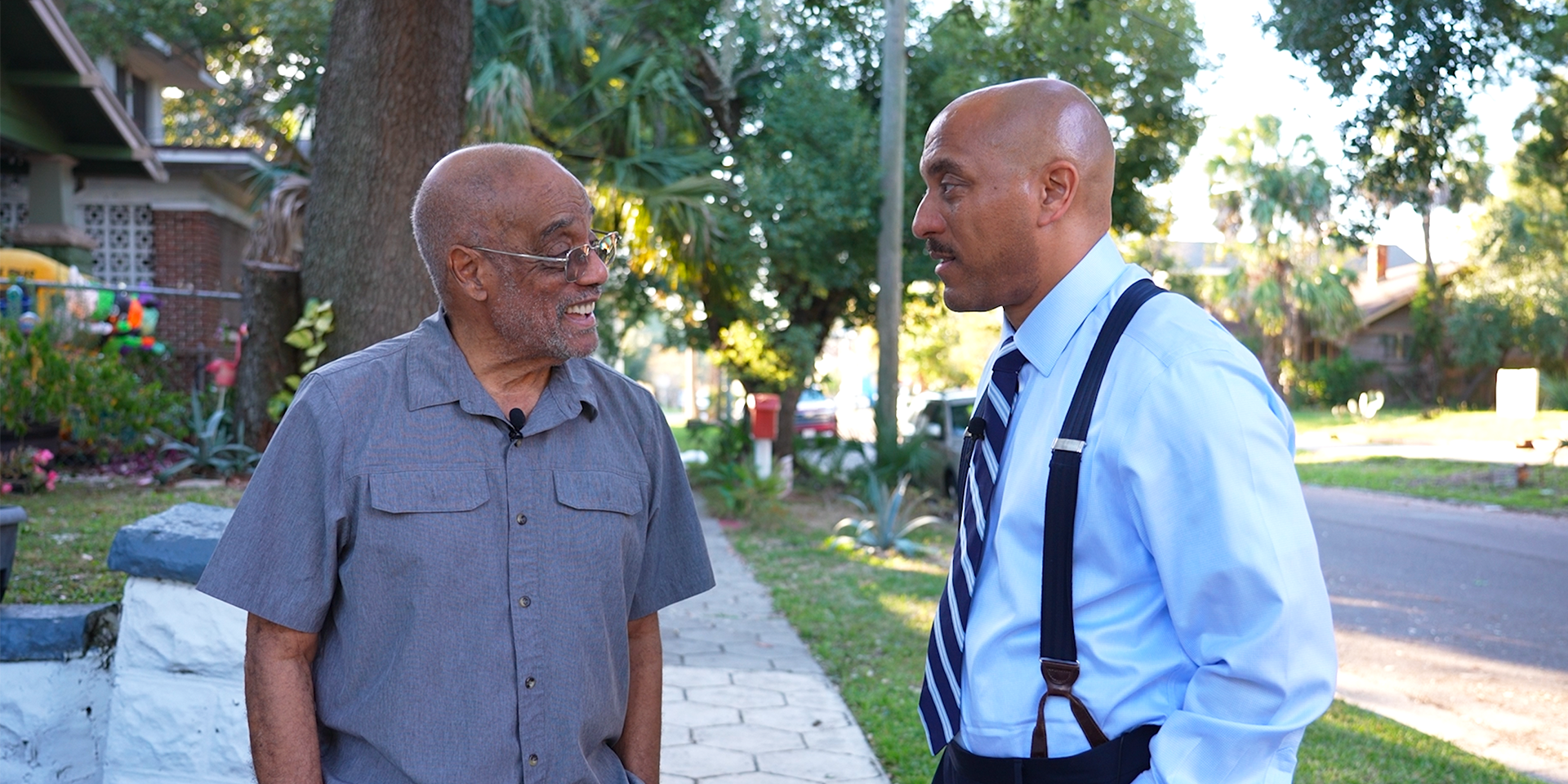 Two men having a conversation outdoors